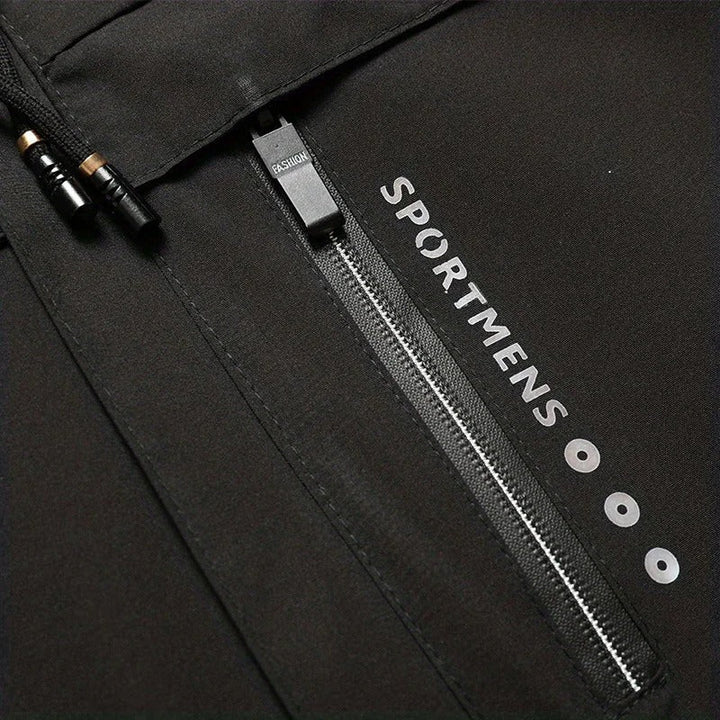 Close-up of zipper pocket and drawcord detail on Dashiell winter jacket