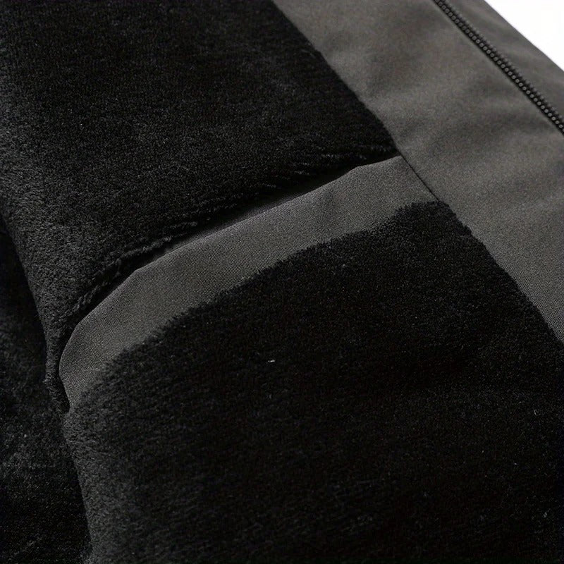 Close-up of zipper pocket and drawcord detail on Dashiell winter jacket