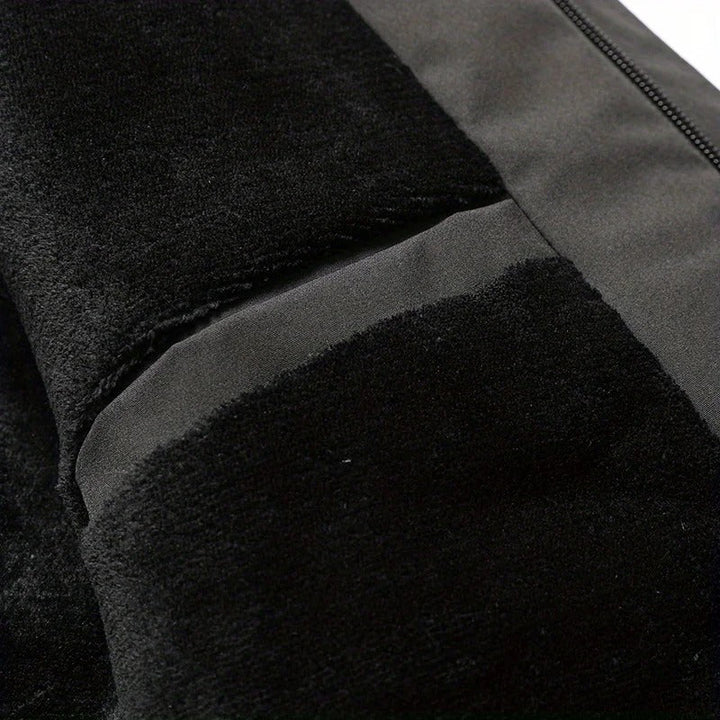 Close-up of zipper pocket and drawcord detail on Dashiell winter jacket