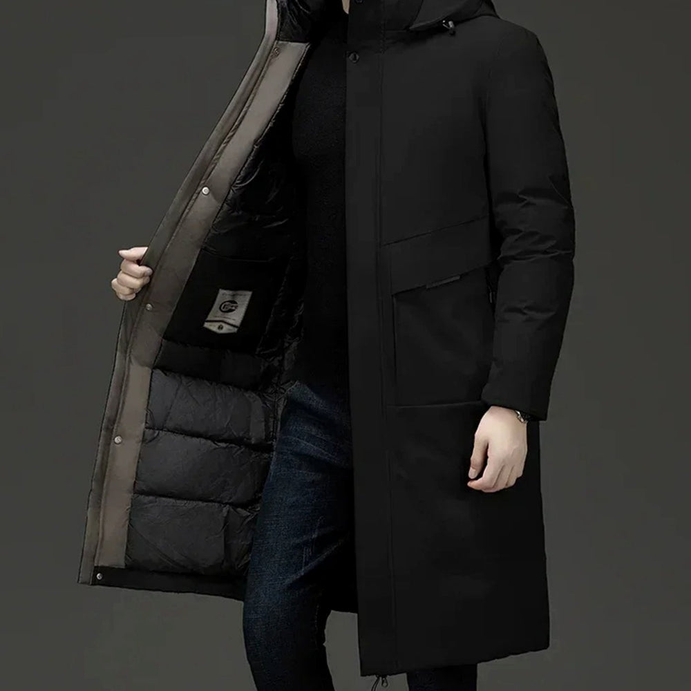 Grant insulated hooded long puffer coat in black, side view with hand opening front