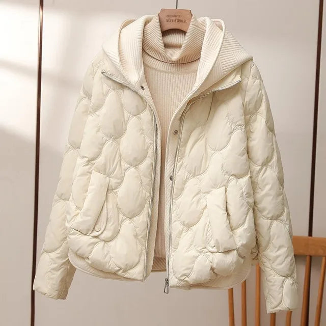 Nova hooded quilted puffer jacket in white, front view on hanger
