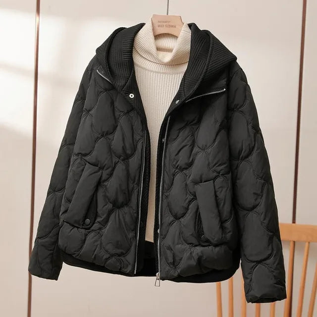 Nova hooded quilted puffer jacket in black, front view on hanger