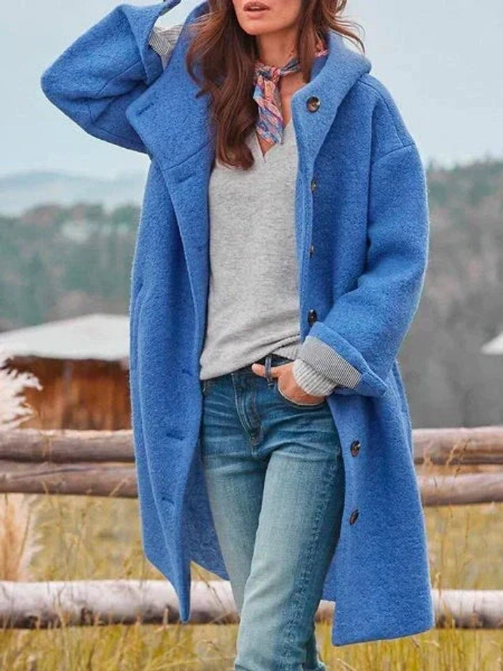 Rosalind hooded button-down winter jacket in blue, front view
