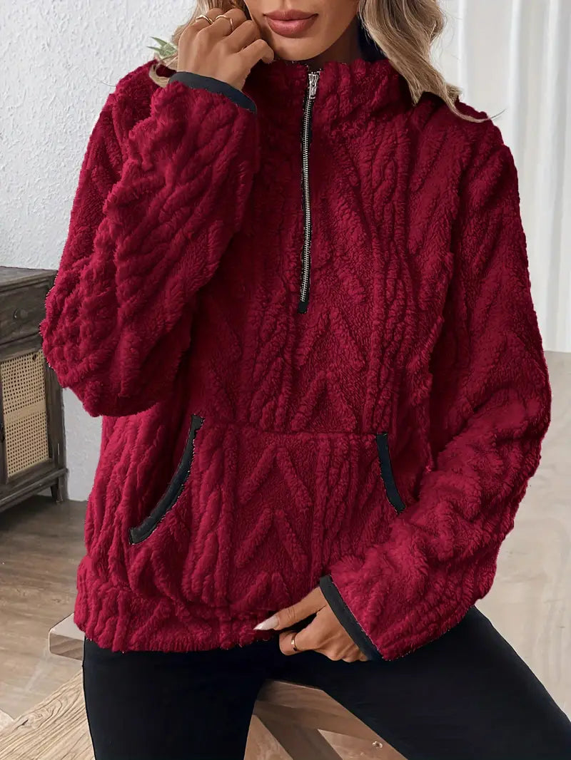 Rosalind cozy fleece pullover in dark red, close-up of quarter-zip collar and kangaroo pocket
