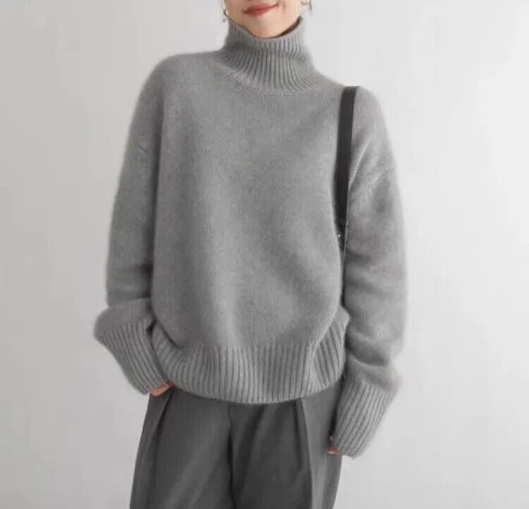 Seraphina oversized gray turtleneck sweater, front view with crossbody bag