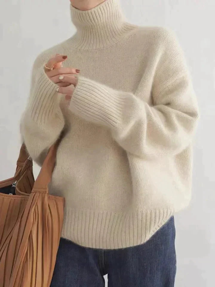 Seraphina oversized cream turtleneck sweater, close-up with tote bag