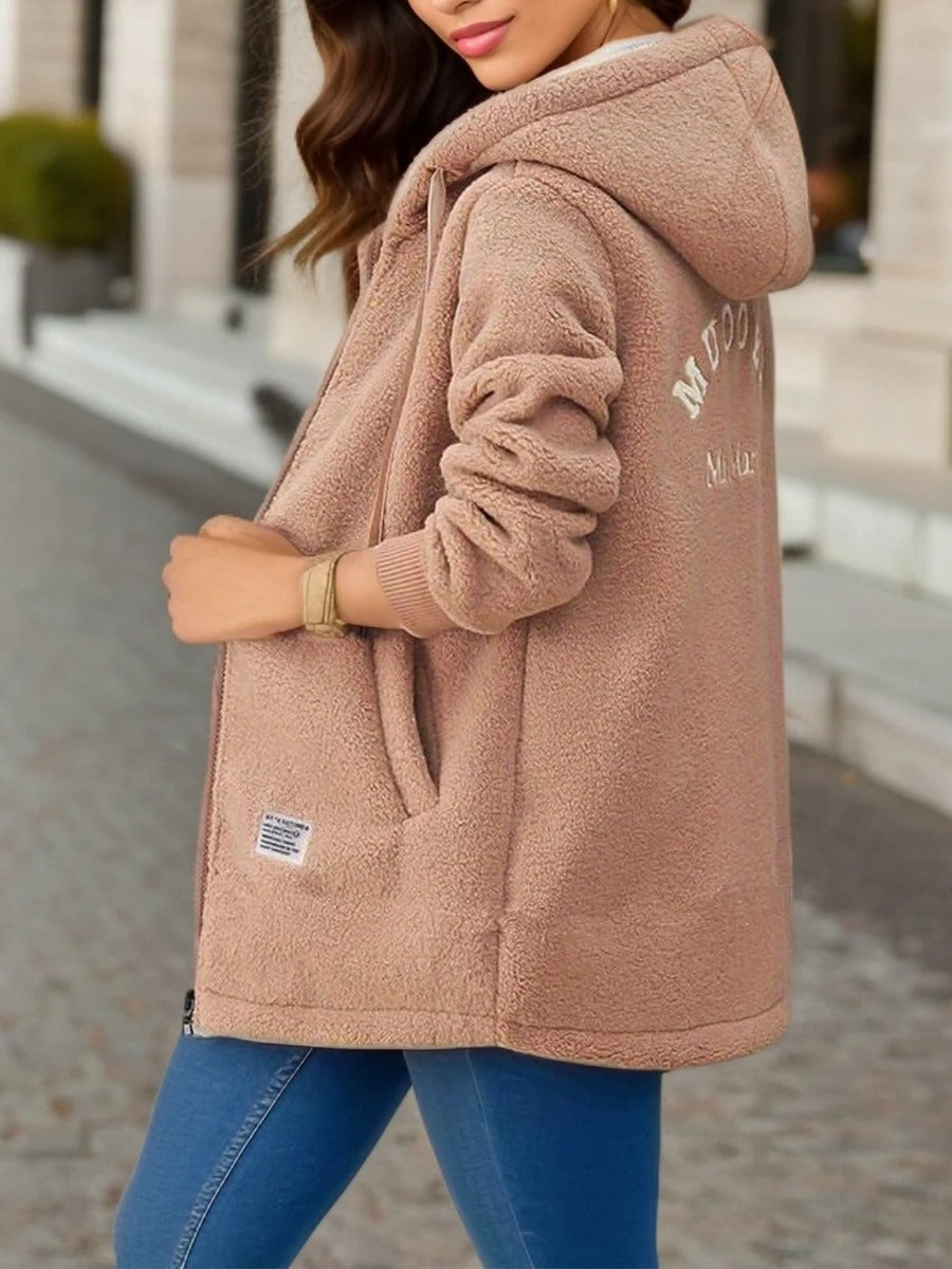 Sienna hooded teddy coat in tan, side view showing embroidered back detail