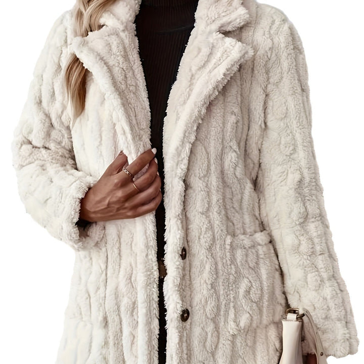 Close-up of Sienna teddy coat texture and button closure