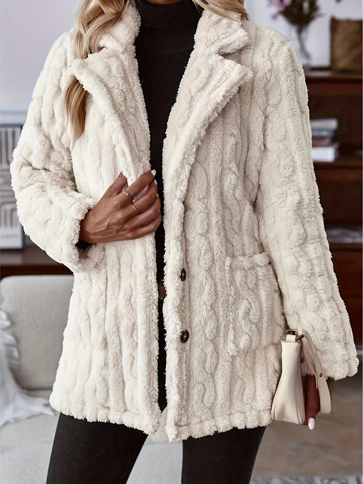 Close-up detail of Sienna teddy coat pockets and buttons