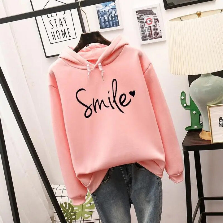 Willa oversized graphic print hoodie in pink, front view on hanger