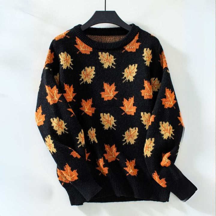 Black leaf print crew neck sweater on hanger