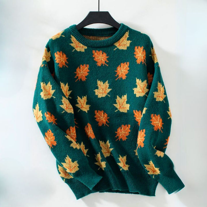 Black leaf print crew neck sweater on hanger