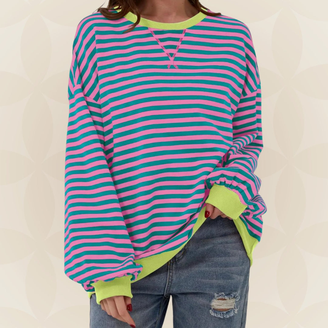 Odette oversized striped crew neck sweater in pink and teal with neon contrast trim, front view