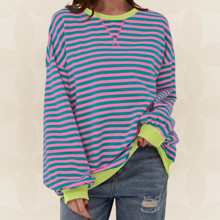 Odette oversized striped crew neck sweater in pink and teal with neon contrast trim, front view