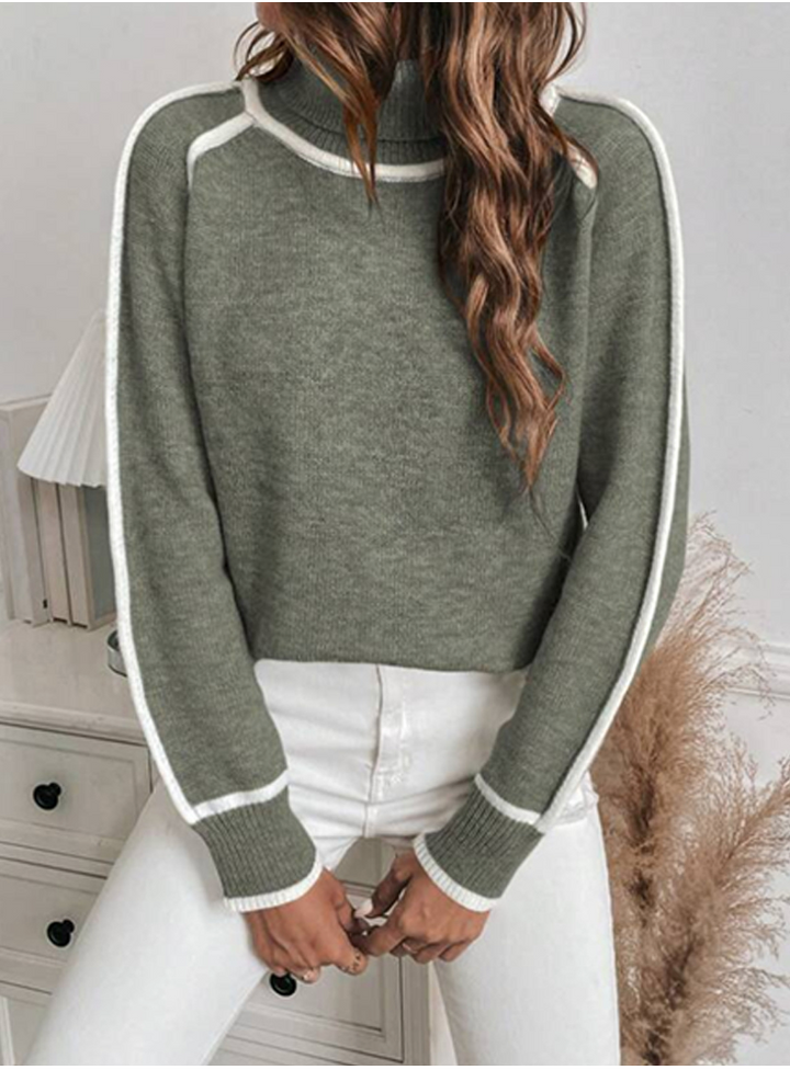 Wren turtleneck pullover sweater in sage green, styled with white jeans