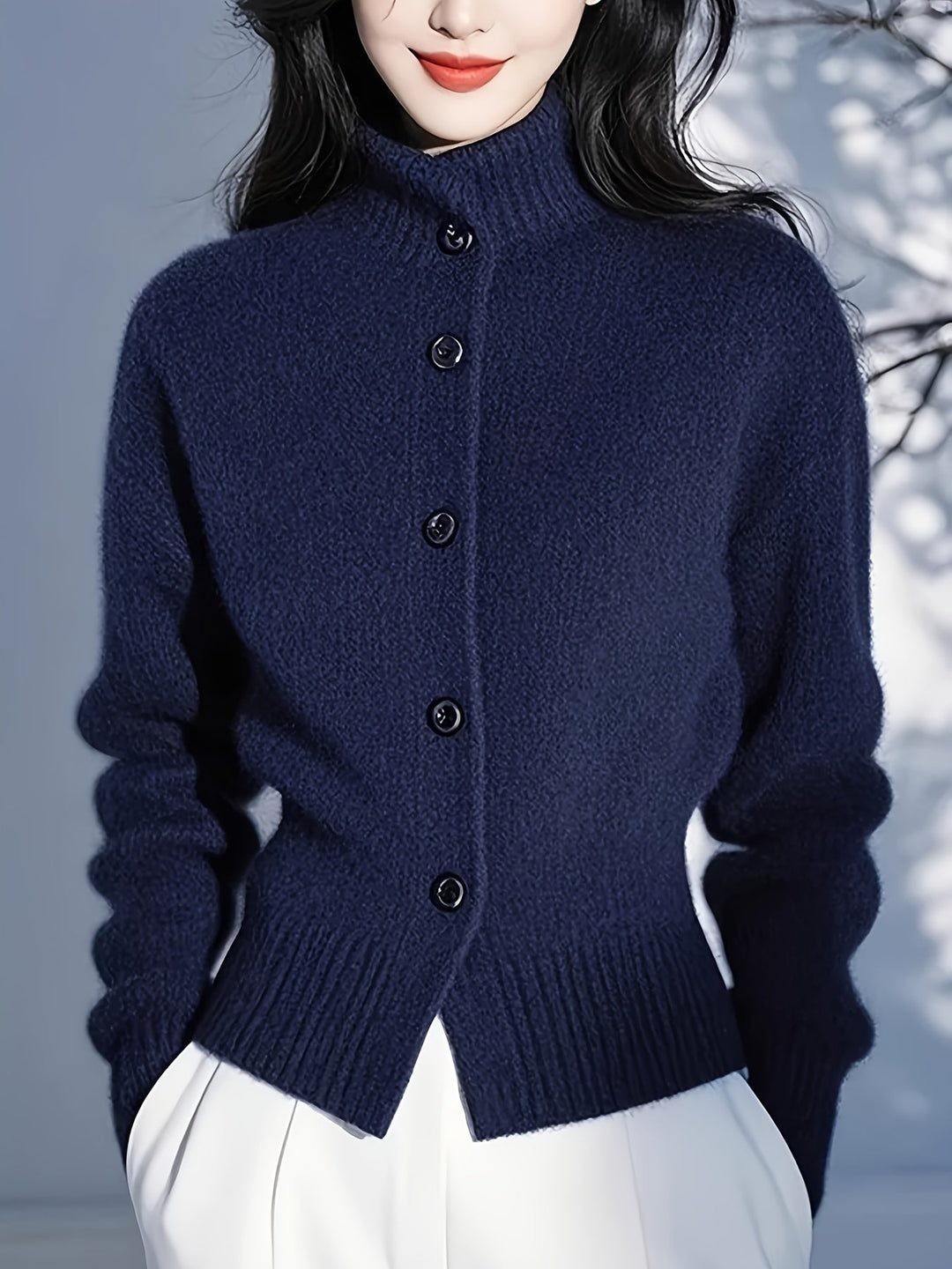 Wren navy high-neck button cardigan, hem and button close-up